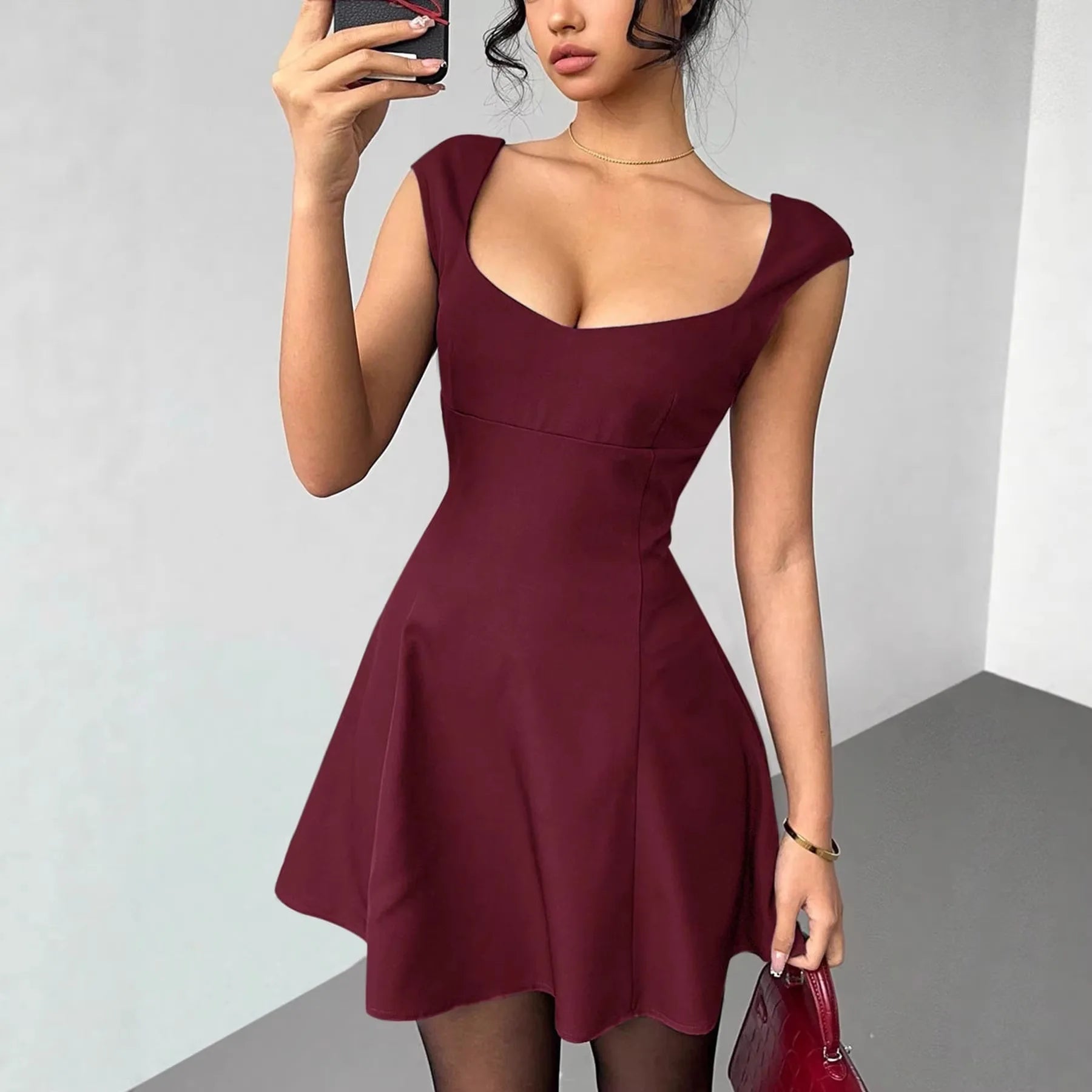 Women's slim fit sleeveless waist cinched mini dress – front view